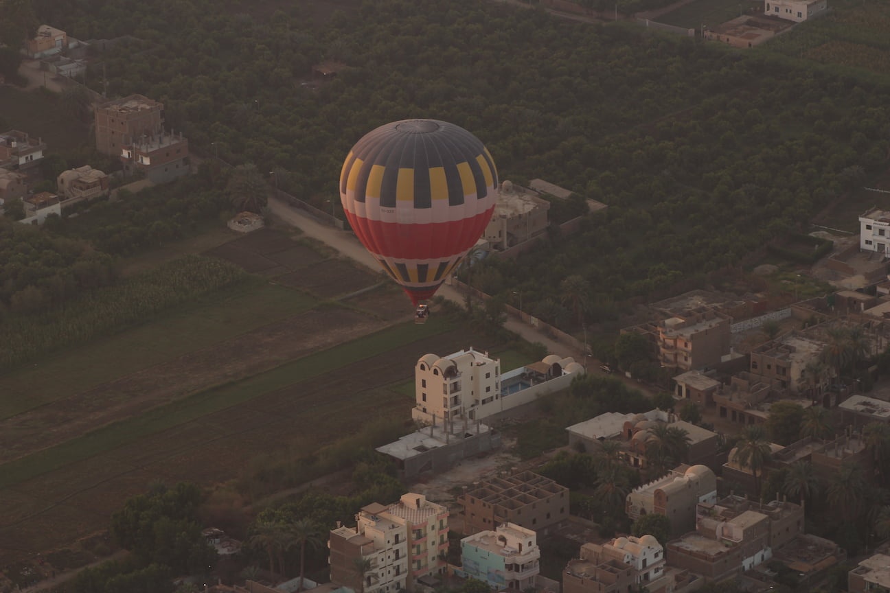 Hot air balloon flying over Casa Loko, in Luxor, Egypt