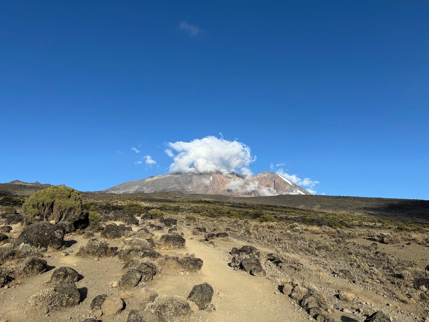 A view of the Kibo peak, with the only cloud in the sky hiding its top