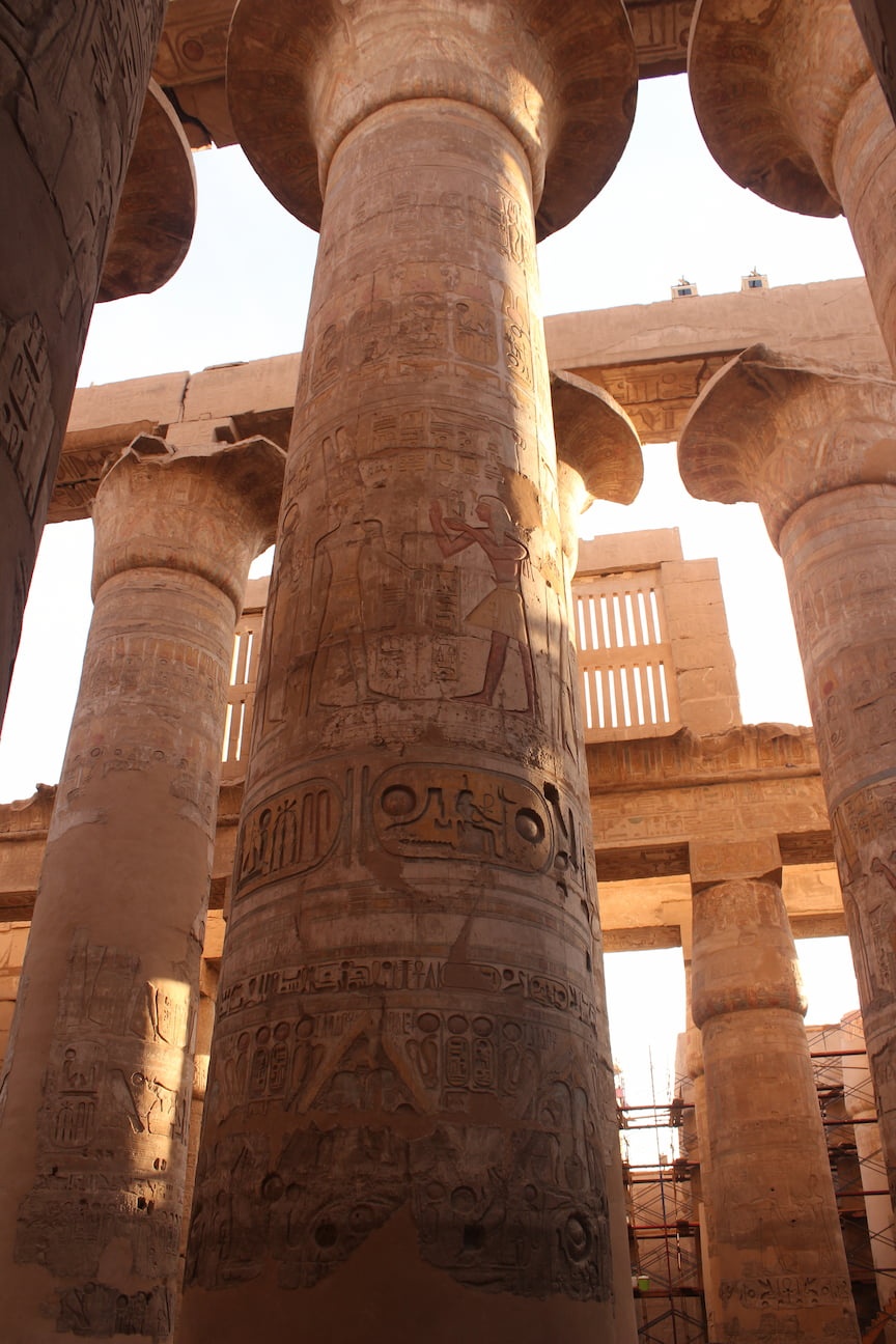 Enormous columns with hieroglyphics, in the Karnak Temple Complex in Aswan, Egypt