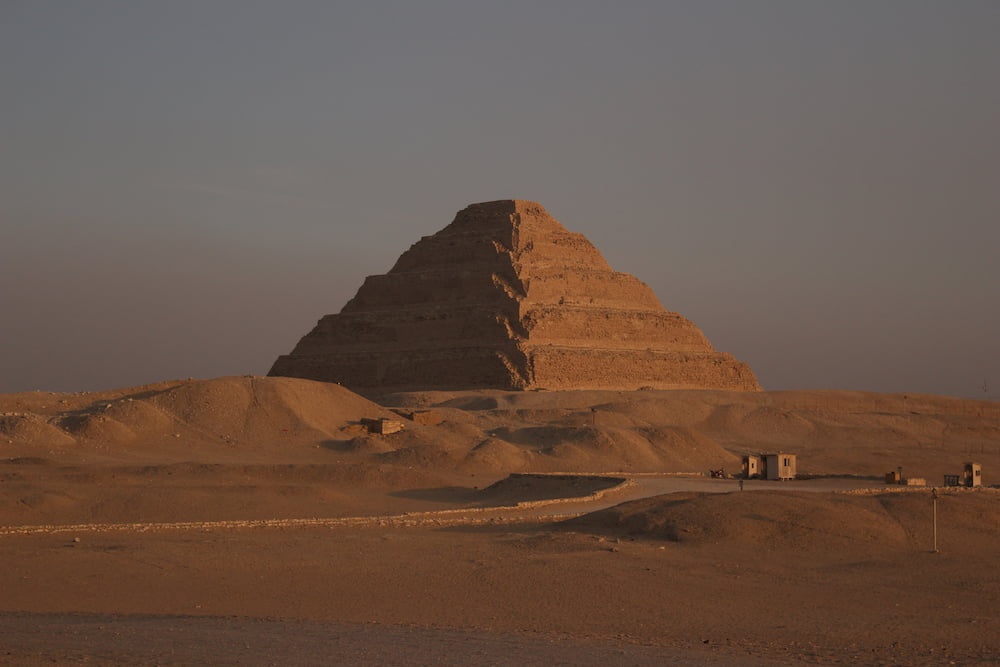 Djoser Pyramid illuminated on one side by the sunset