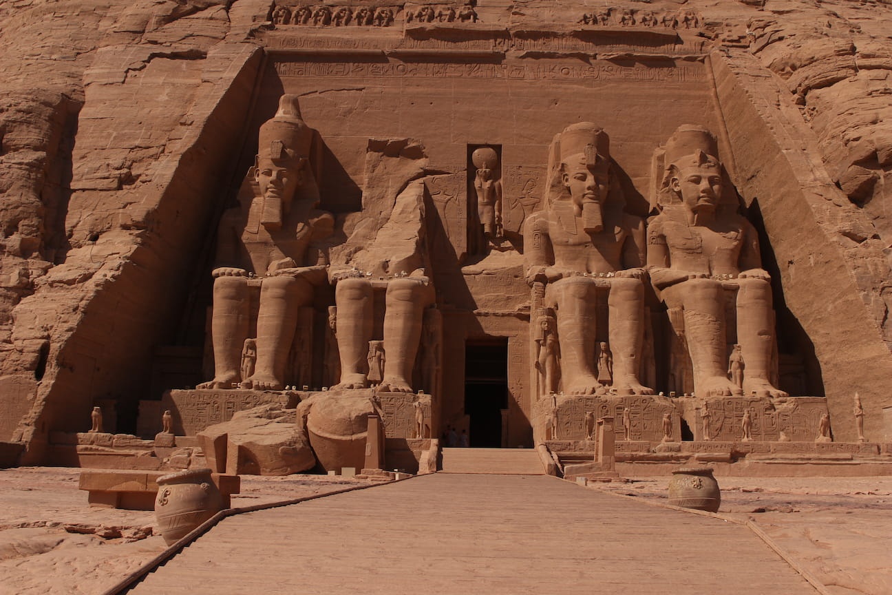 Abu Simbel Temple complex in Aswan, Egypt, featuring colossal statues of Ramesses II.