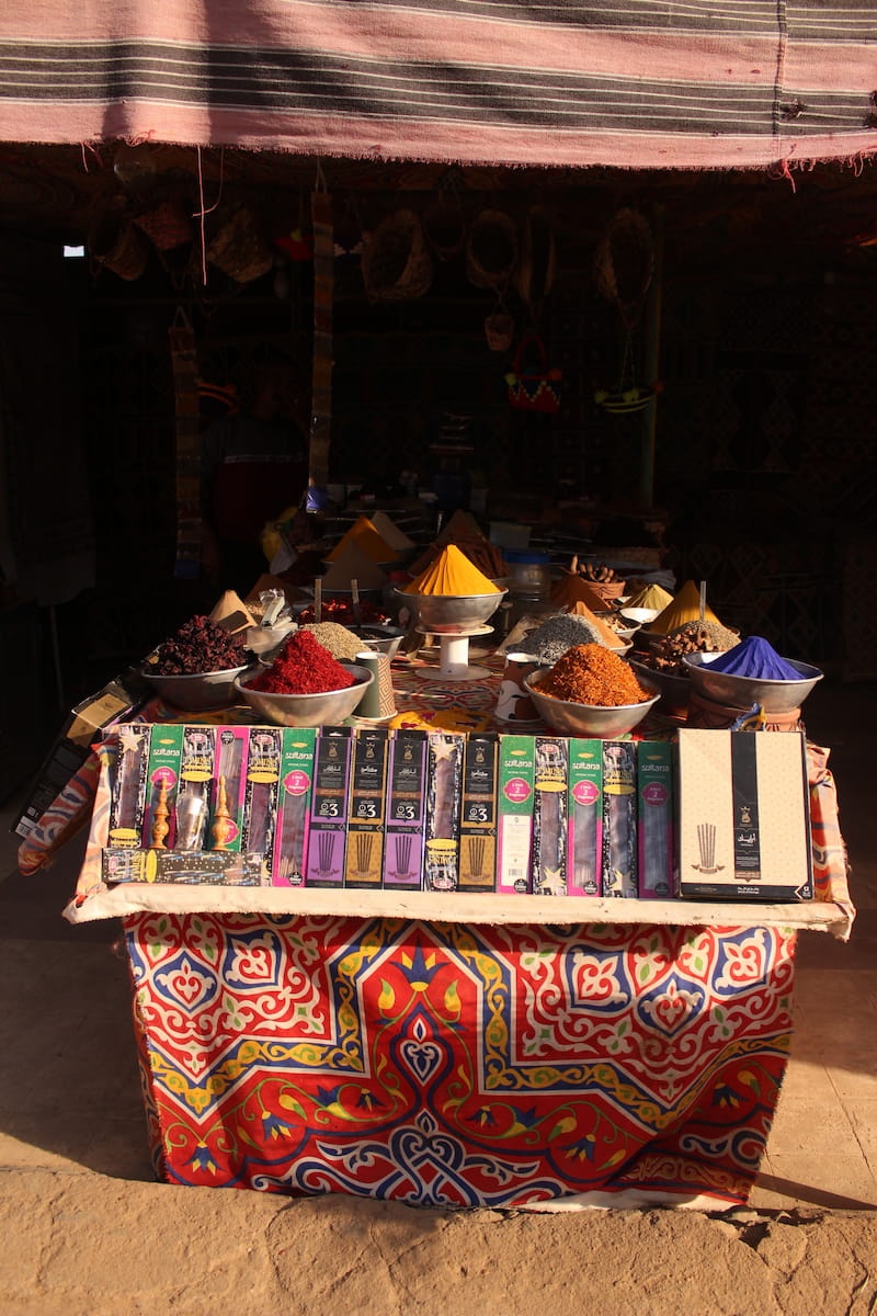 Colorful market in Aswan, Egypt, selling spices.
