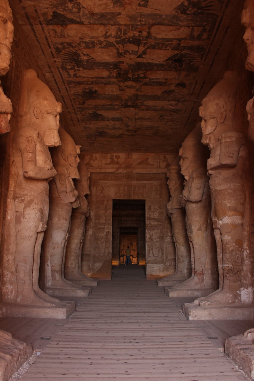 Corridor with tall statues of pharaohs